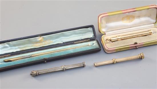 Four gold pencil holders, English and French, late 19th - 20th century, largest 6in.